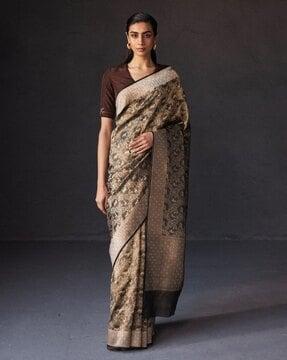 women banarasi woven saree with tassels