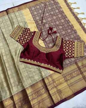 women banarasi woven saree with zari accent