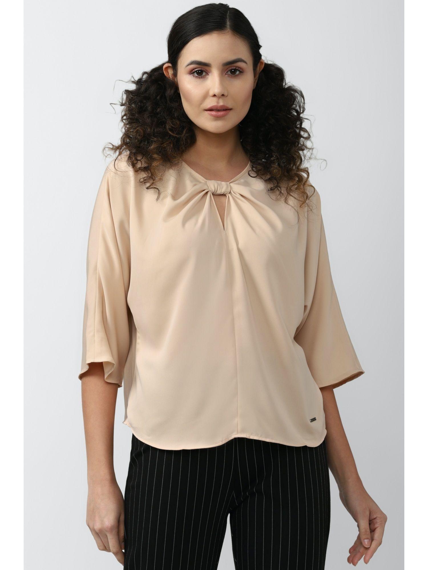 women beige top