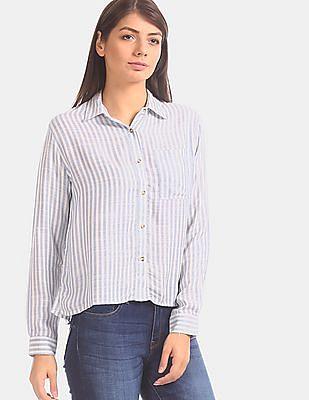 women blue and white long sleeve vertical stripe shirt