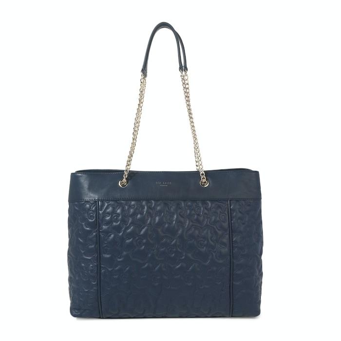 women blue magnolia quilted leather tote bag