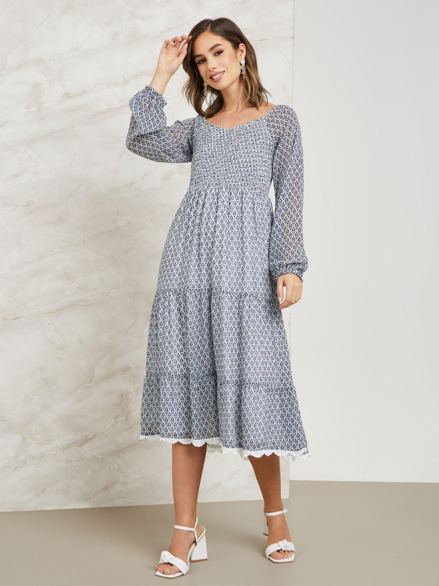 women blue smocked midi length tiered dress