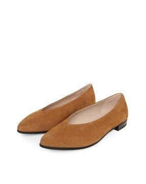 women brown shape pointy ballerinas