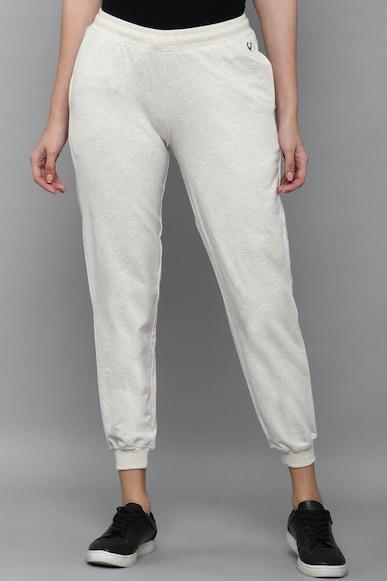 women cream regular fit solid casual trousers