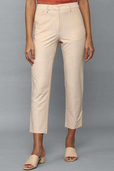 women cream regular fit solid casual trousers