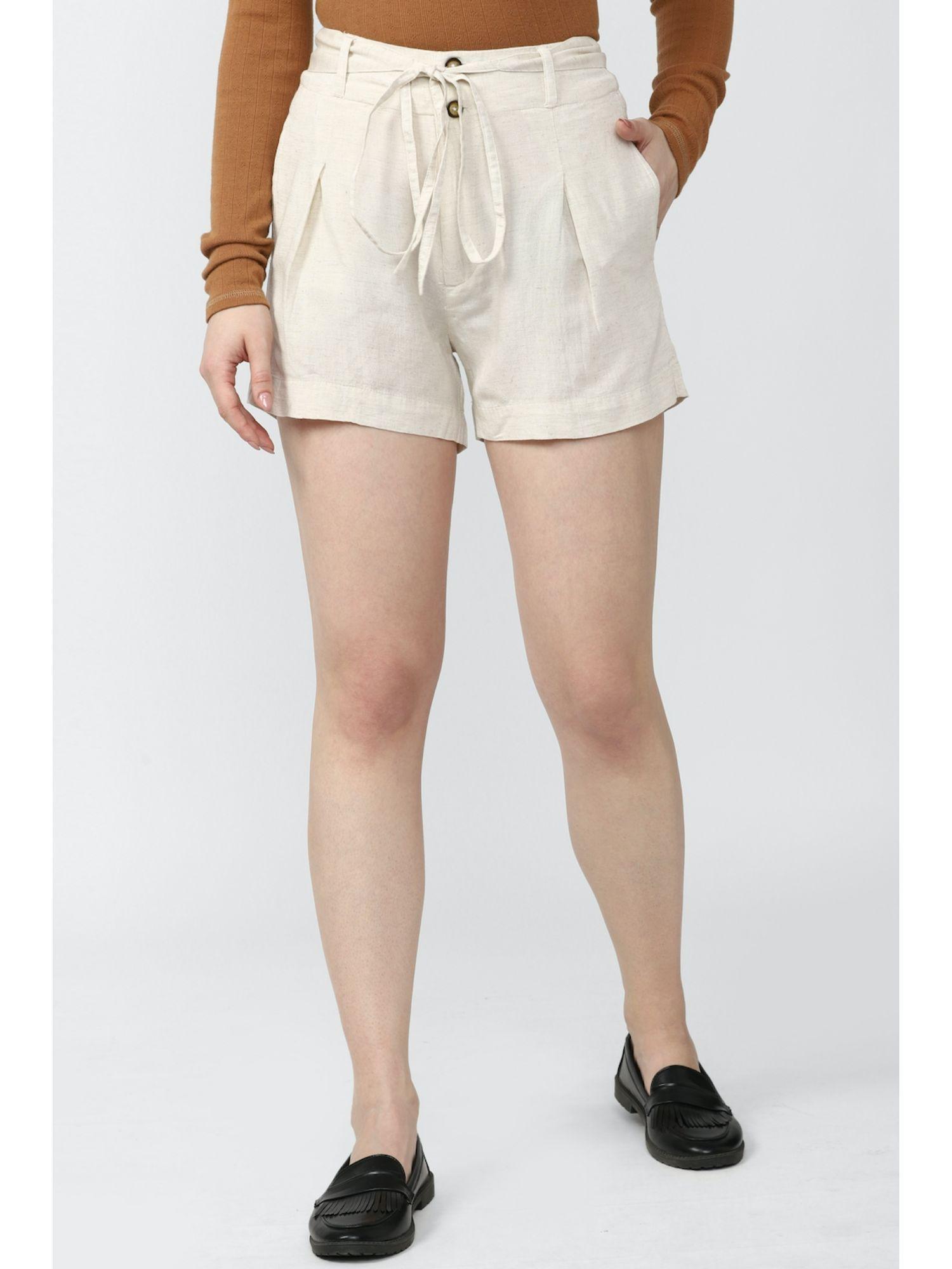 women cream solid shorts