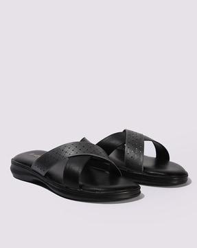 women criss-cross open-toe slides