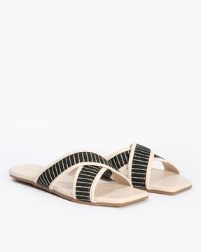 women criss-cross strap slides