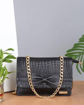 women croc-embossed sling bag with magnetic closure