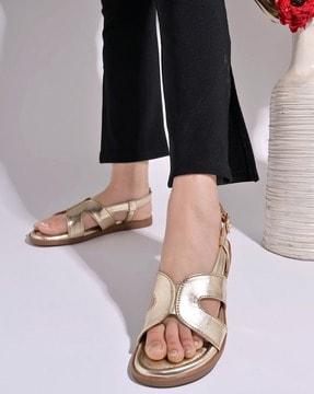 women cross strappy sandals with buckle closure