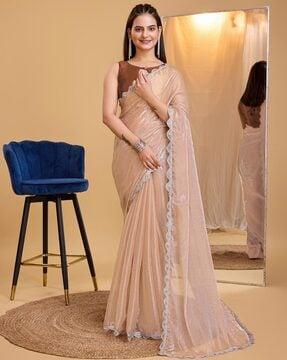 women embellished saree with scalloped border