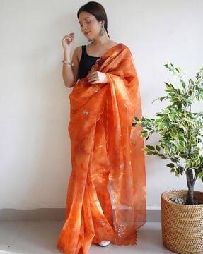 women embellished saree with scalloped border