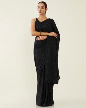 women embellished saree with unstitched blouse piece