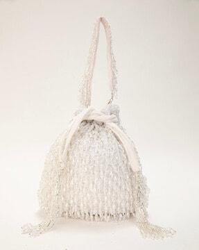 women embellished sling bag