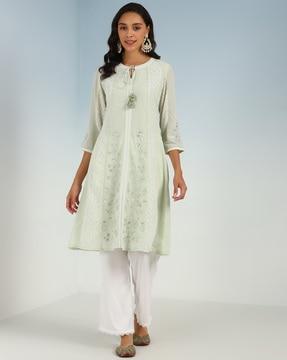 women embroidered a-line kurta with tie-up tasses