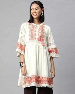 women embroidered flared kurti with tie-up
