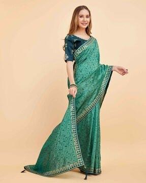 women embroidered saree with contrast border