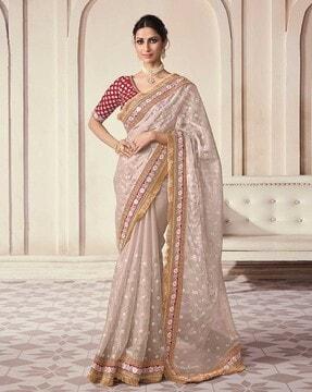 women embroidered saree with contrast border