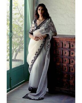 women embroidered saree with contrast border