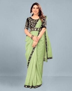 women embroidered saree with contrast border