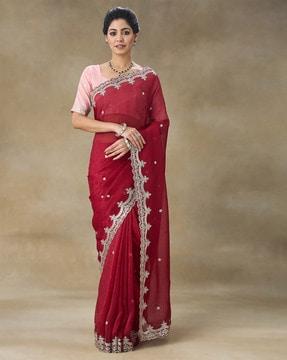 women embroidered saree with cut-out border