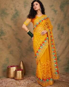 women embroidered saree with cutout border