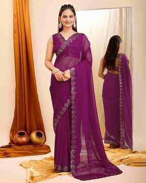 women embroidered saree with cutout border