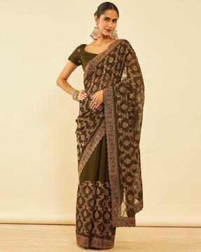 women embroidered saree with scalloped border