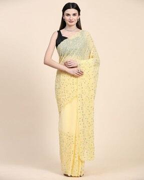women embroidered saree with scalloped border