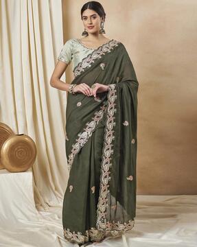 women embroidered saree with scalloped border