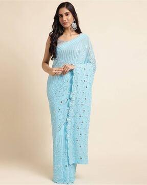 women embroidered saree with scalloped border