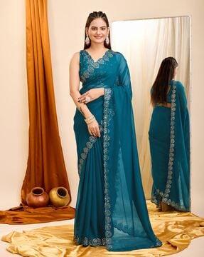 women embroidered saree with scalloped border