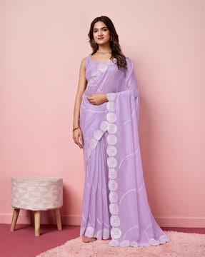 women embroidered saree with scalloped border