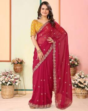 women embroidered saree with scalloped border