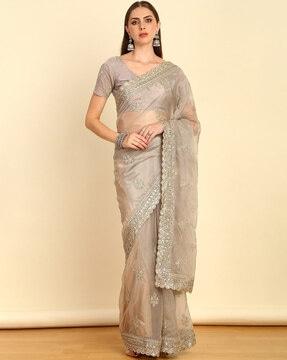 women embroidered saree with scalloped hem