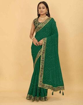 women embroidered saree with tassels