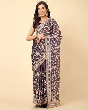 women embroidered saree with tassels