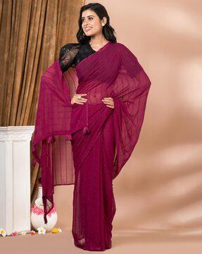 women embroidered saree with tassels