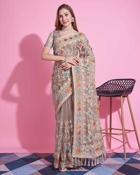 women embroidered saree with tassels