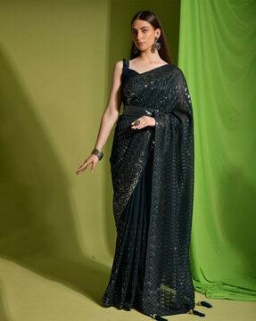 women embroidered saree with tassels