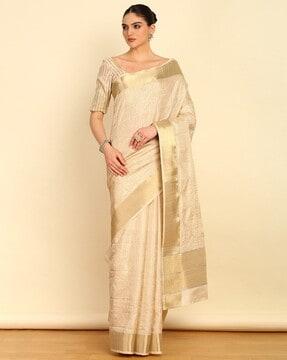 women embroidered tussar saree