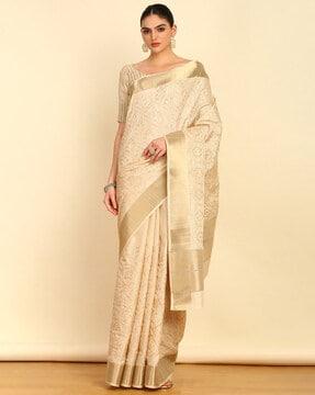 women embroidered tussar saree