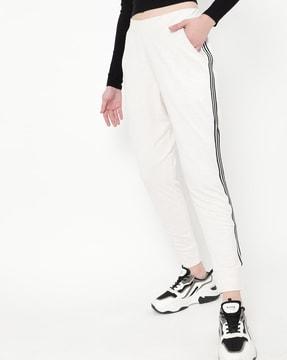 women fitted track pants with contrast taping