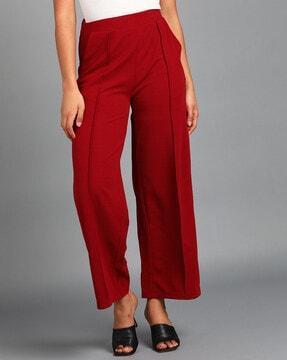 women flared fit pleat-front pants