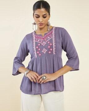 women flared regular fit tunic with embroidery