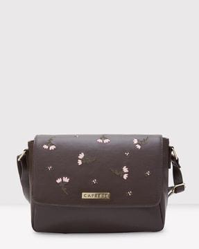 women floral print sling bag with snap-button closure