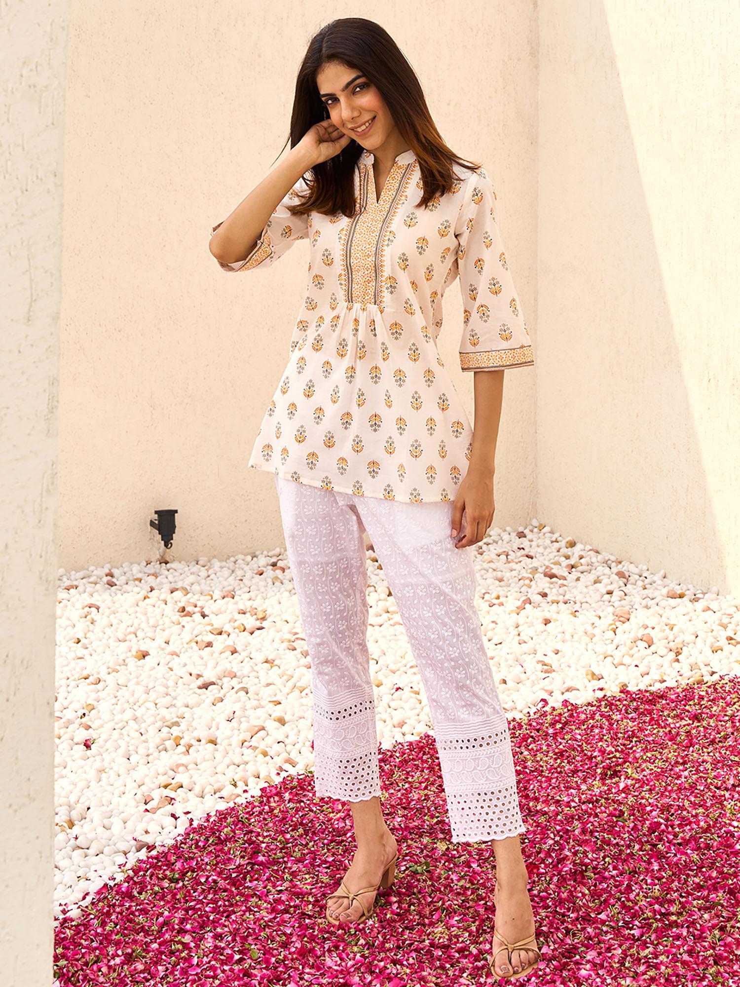 women floral printed white kurti with a pleated style