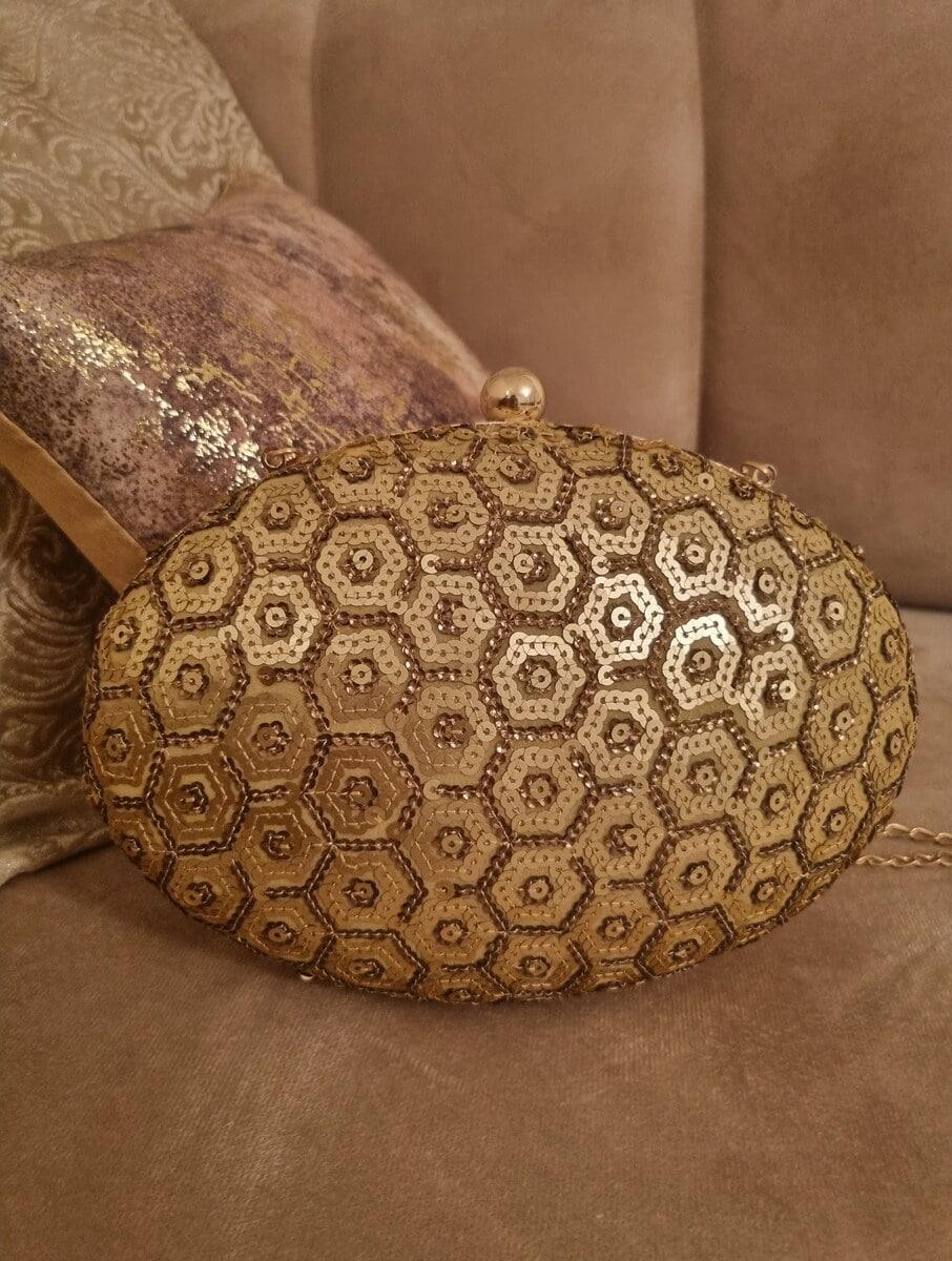 women gold georgette clutches