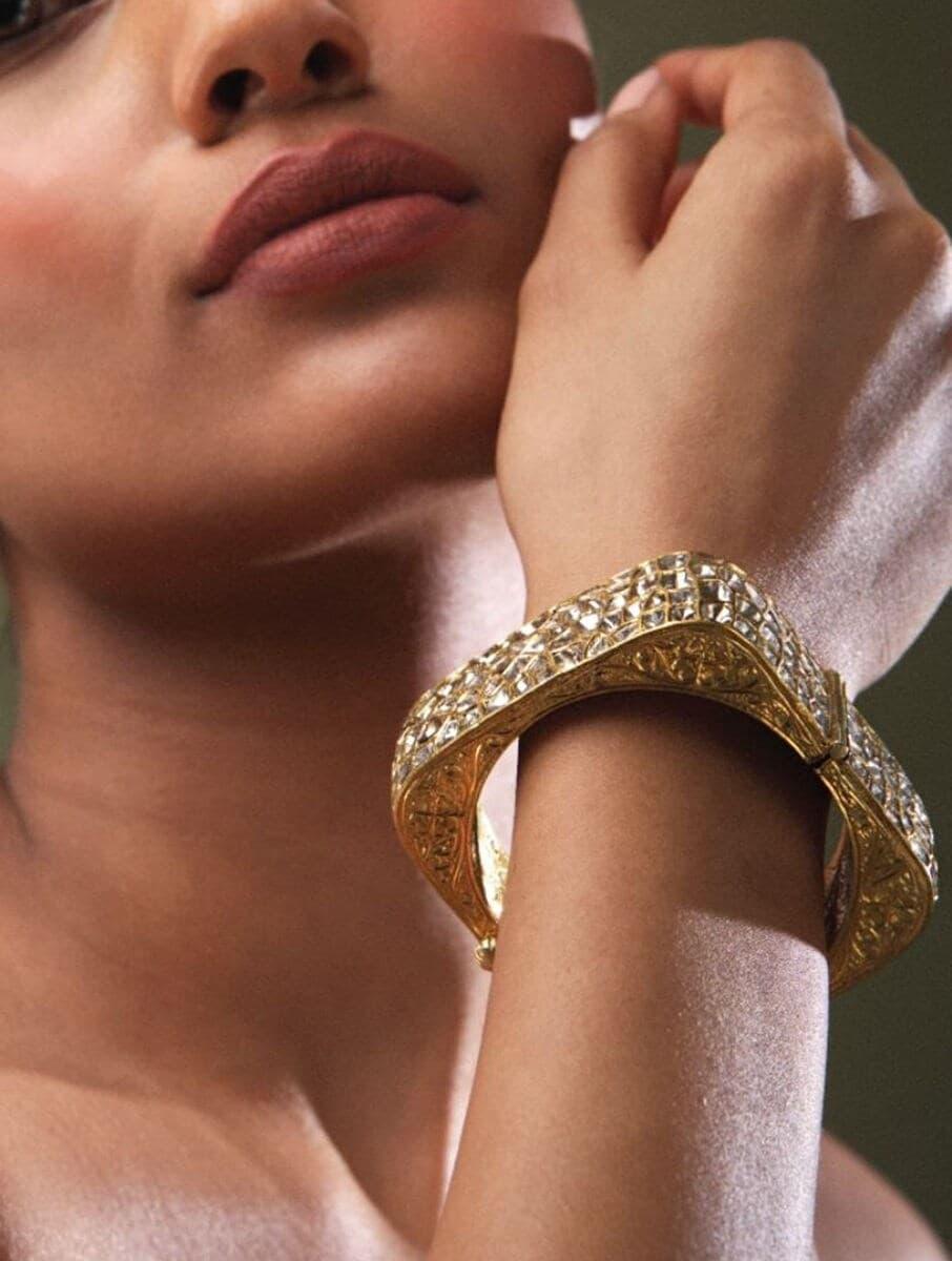 women gold hinged back gold bangles