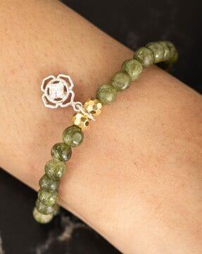 women gold-plated beaded stretch bracelet with flower charm